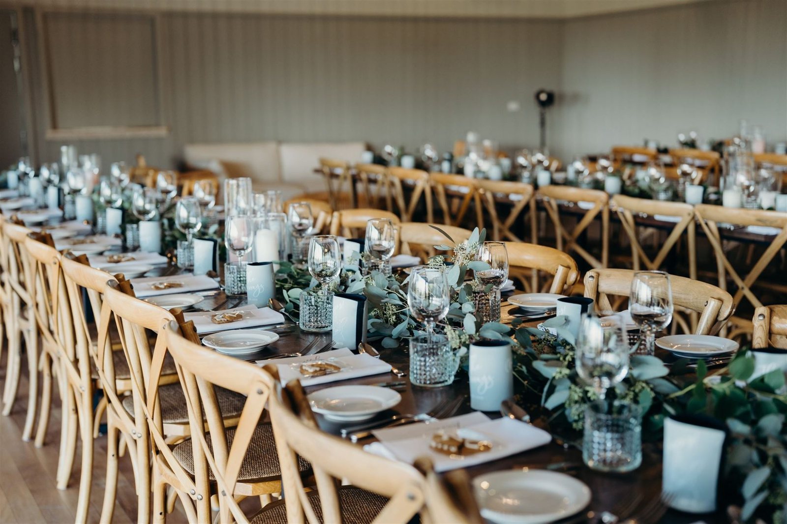 Table detail: crossback chairs, candles and a eucalyptus runner